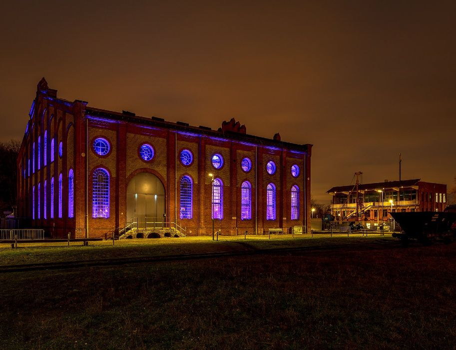 The Energeticon in Alsdorf shines in blue light in the evening