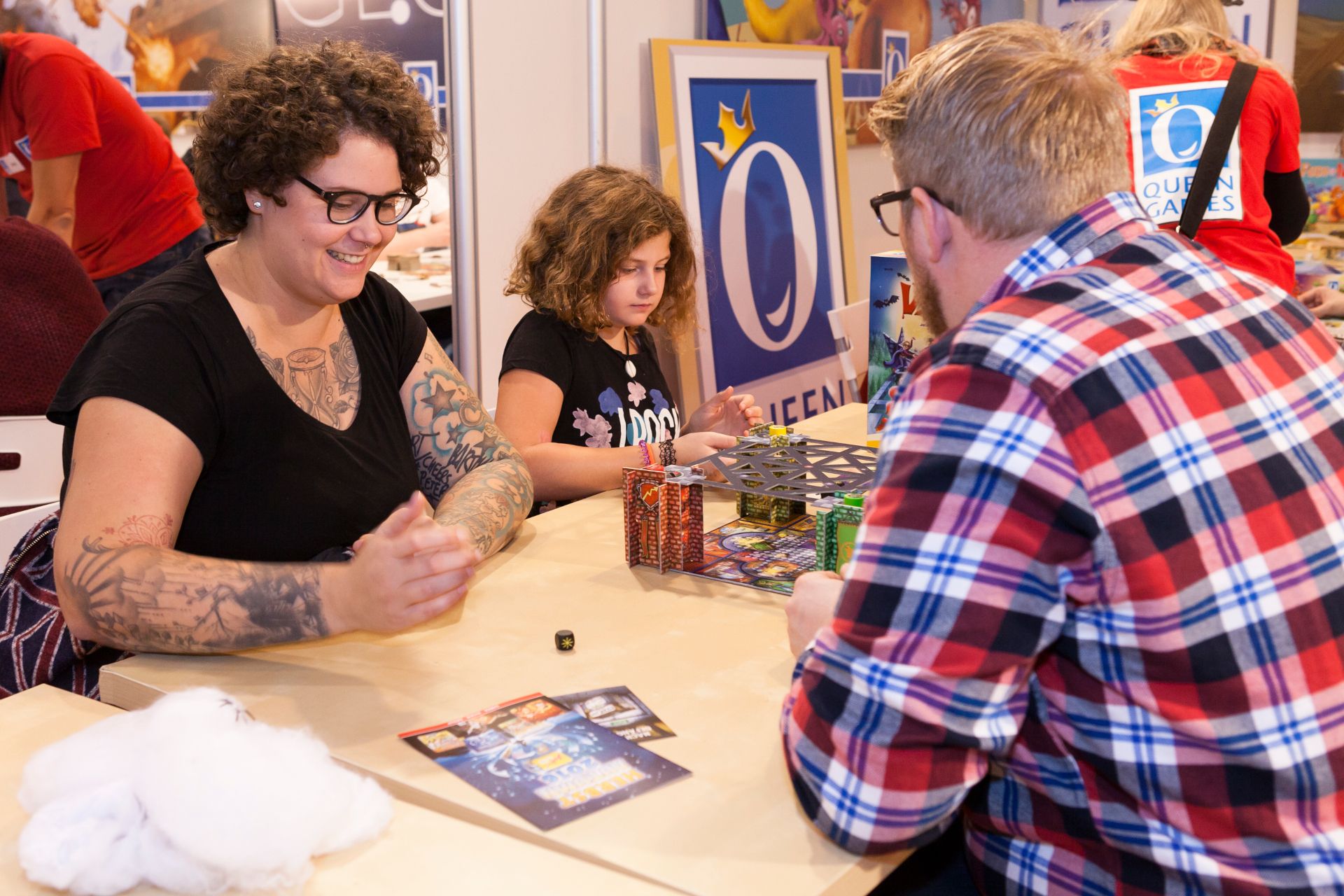 Young and old learn how individual games work at the SPIEL Essen trade fair stands