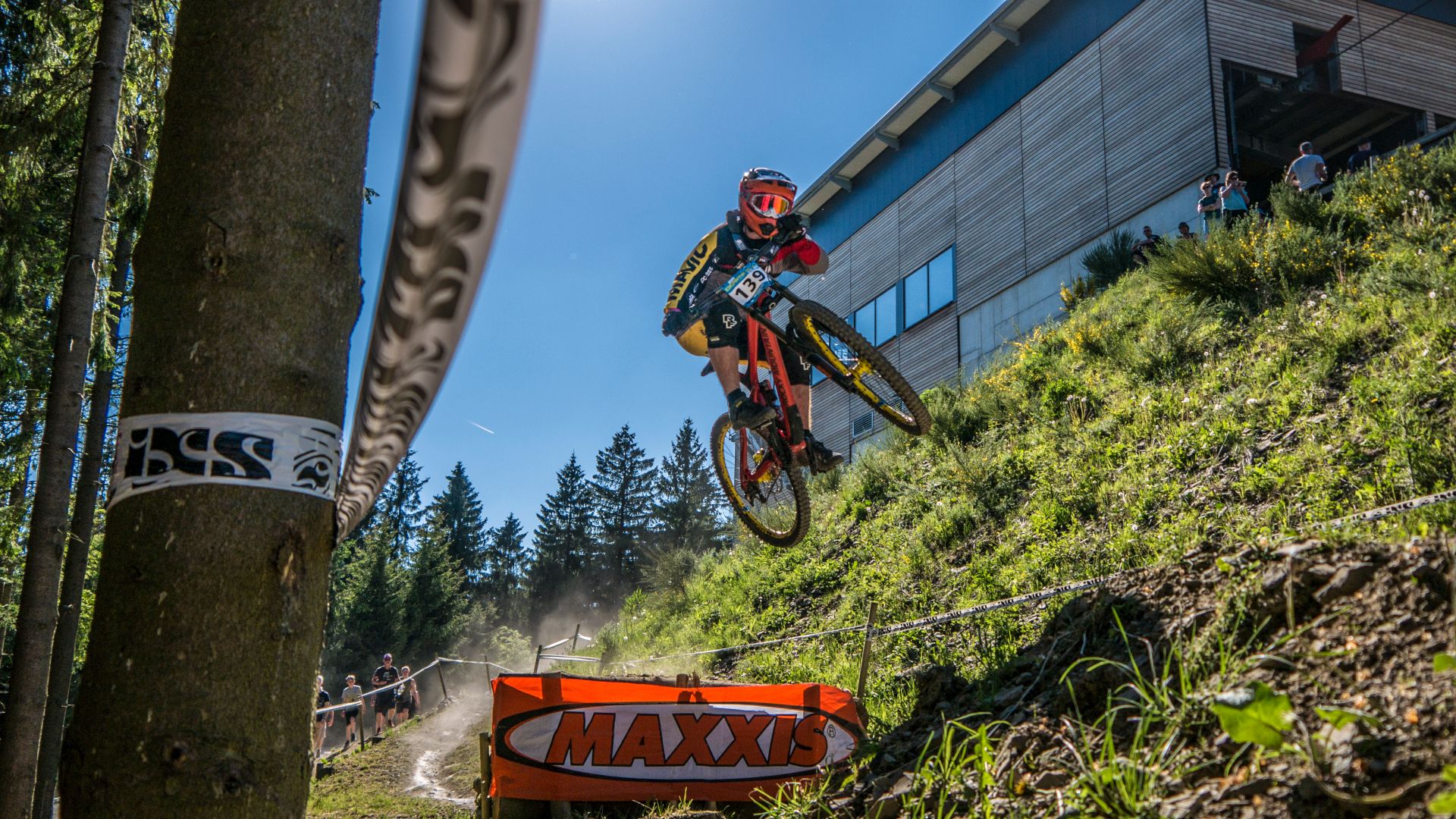 Participants in the competitions ride down the downhill trails at high speed. They almost fly over hills and ledges