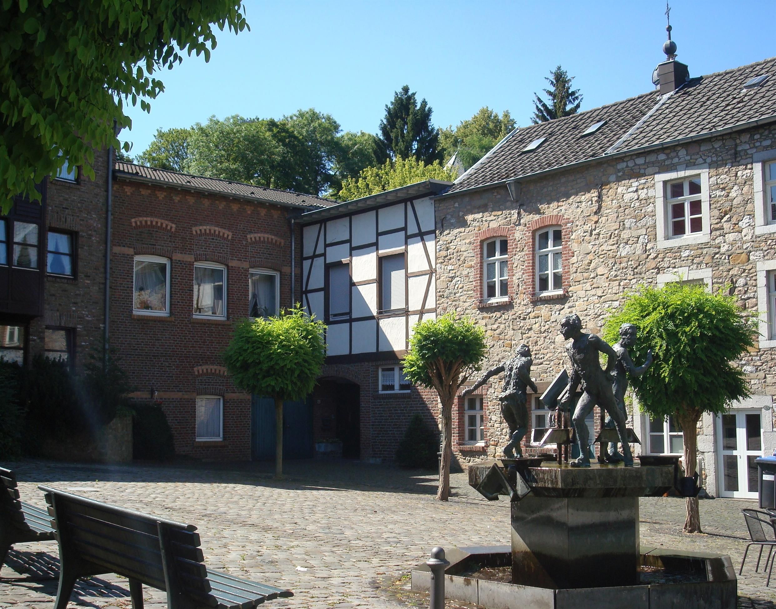 Market square with fountain and historic houses