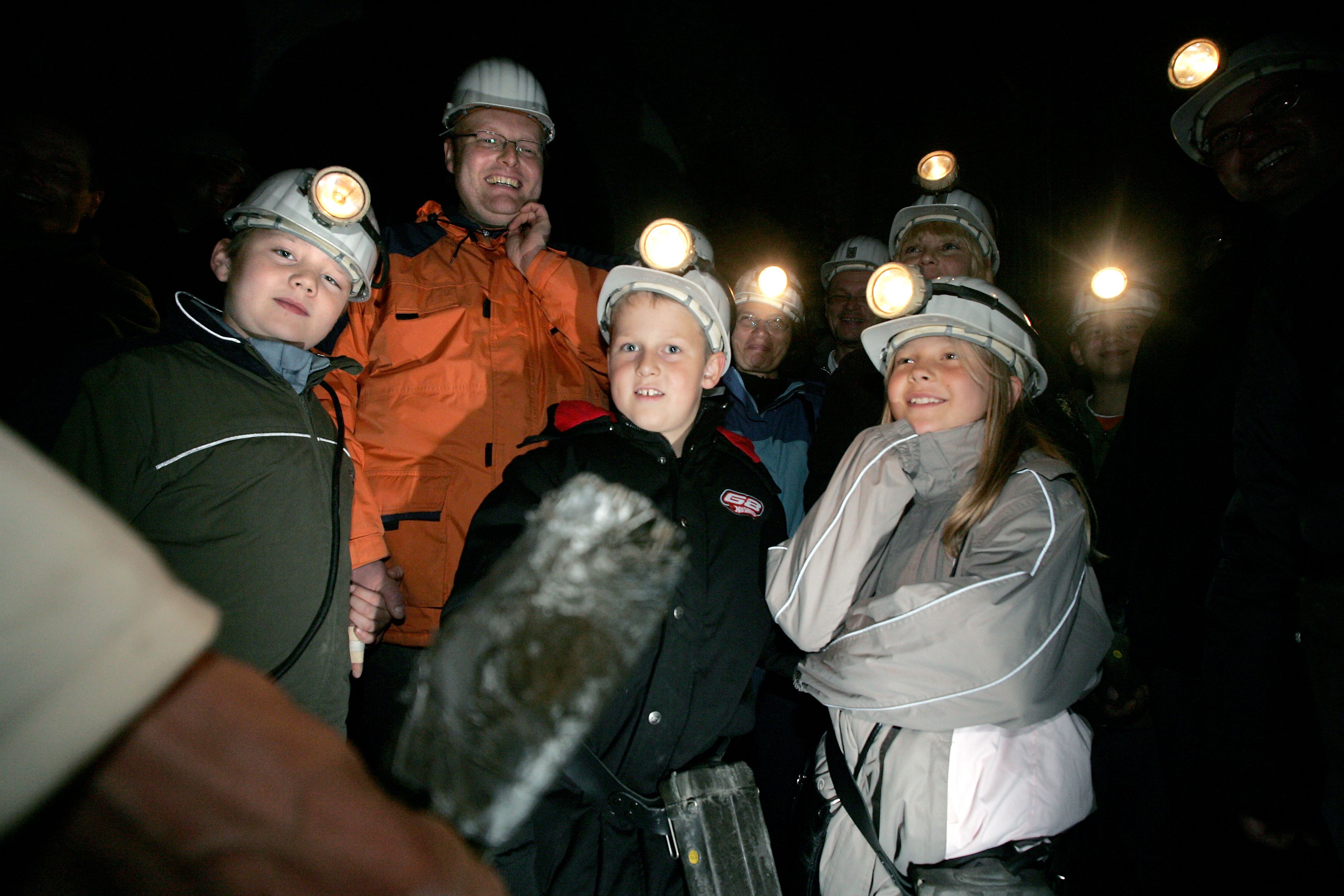 On the Night Shift Special group tour, guests are guided by miners' lamps